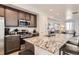 Stylish kitchen featuring granite countertops, stainless steel appliances and island seating at 5332 13Th St, Frederick, CO 80504
