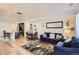 Spacious living room with an open concept to the kitchen and dining area with modern furnishings and decor at 5332 13Th St, Frederick, CO 80504