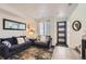 Comfortable living room with modern decor, a stylish rug, and plenty of natural light from the window at 5332 13Th St, Frederick, CO 80504
