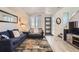 Comfortable living area featuring stylish seating, an area rug, and modern decor for an inviting feel at 5332 13Th St, Frederick, CO 80504