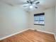 Bright bedroom featuring hardwood floors and a ceiling fan at 2265 Locust St, Denver, CO 80207