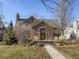 Brick home with landscaped yard and walkway at 2265 Locust St, Denver, CO 80207