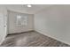 Bright bedroom with wood-look flooring and neutral walls, offering a serene and inviting space at 8722 Dudley Ct, Arvada, CO 80005