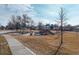 Neighborhood park features a playground with picnic tables and benches at 8722 Dudley Ct, Arvada, CO 80005