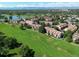 An aerial view of the community, showcasing the golf course and surrounding homes at 3026 W Prentice Ave # G, Littleton, CO 80123