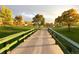 Picturesque bridge leading through a golf course landscape with lush trees and lake at 3026 W Prentice Ave # G, Littleton, CO 80123