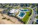 Aerial view showcases community pool with ample green space, and clubhouse in a desirable neighborhood at 697 Gamble Oak St, Brighton, CO 80601