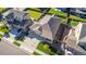 Aerial view of a single-Gathering home with a well-maintained yard, private backyard, and convenient driveway parking at 697 Gamble Oak St, Brighton, CO 80601