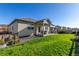 Expansive backyard with lush green lawn and a patio, ideal for outdoor activities and gatherings at 697 Gamble Oak St, Brighton, CO 80601