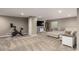 Finished basement featuring plush carpet, neutral gray walls and a comfortable seating area at 697 Gamble Oak St, Brighton, CO 80601
