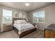 Bright bedroom with natural light, neutral color palette, and modern decor, creating a serene and inviting retreat at 697 Gamble Oak St, Brighton, CO 80601