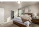 Bright and airy primary bedroom with generous sunlight, neutral walls, and plush carpeting, perfect for relaxation at 697 Gamble Oak St, Brighton, CO 80601