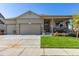 Charming single-story home featuring a well-manicured lawn and a two-car garage at 697 Gamble Oak St, Brighton, CO 80601