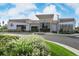 Front exterior of the Venture Center featuring a modern design, manicured landscaping, and easy access from the street at 697 Gamble Oak St, Brighton, CO 80601