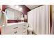 Modern bathroom with a sleek vanity, elegant mirror, and shower-tub combination at 982 E 130Th Cir, Thornton, CO 80241