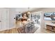 Open dining area connected to the kitchen with a view of a fenced backyard, creating a welcoming atmosphere at 982 E 130Th Cir, Thornton, CO 80241
