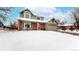 Inviting two-story home with brick accents and a covered front porch at 982 E 130Th Cir, Thornton, CO 80241
