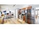 Modern kitchen with stainless steel appliances, ample counter space, and a seamless flow to the dining area at 982 E 130Th Cir, Thornton, CO 80241