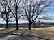 Beautiful scenery of the lake with a sitting area on the banks to enjoy the views on a sunny day at 982 E 130Th Cir, Thornton, CO 80241