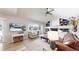 Comfortable living room with a brick fireplace, plush seating, and a bright window view, perfect for relaxation at 982 E 130Th Cir, Thornton, CO 80241