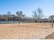 Bright image of the community sand volleyball court with views of the community and play area in the background at 982 E 130Th Cir, Thornton, CO 80241