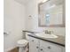 Bright half bathroom with new fixtures and updated vanity at 5960 S Jellison St # B, Littleton, CO 80123