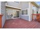 Outdoor deck area for relaxing and entertaining, with gray siding and sliding door access to the interior at 5960 S Jellison St # B, Littleton, CO 80123