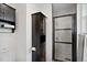 Modern bathroom featuring a stylish black vanity, a glass-enclosed shower with dark trim and a toilet at 1359 S Brentwood Way, Lakewood, CO 80232