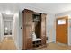 Entryway featuring wooden floors and a large wooden cabinet at 1359 S Brentwood Way, Lakewood, CO 80232