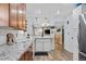Kitchen counter view featuring stainless steel appliances, white subway tiles, and granite countertops at 1359 S Brentwood Way, Lakewood, CO 80232