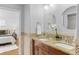 Bathroom featuring granite countertops, double sinks, and an adjoining bedroom at 1845 W 39Th Ave, Denver, CO 80211