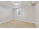 Bright bedroom featuring carpet flooring, window, and neutral color scheme at 1845 W 39Th Ave, Denver, CO 80211