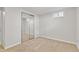 Carpeted bedroom with closet, window, and neutral color scheme at 1845 W 39Th Ave, Denver, CO 80211