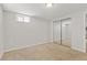 Carpeted bedroom with closet, window, and neutral color scheme at 1845 W 39Th Ave, Denver, CO 80211