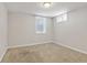 Bright bedroom featuring carpet flooring, window, and ample natural light at 1845 W 39Th Ave, Denver, CO 80211