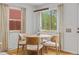 Bright dining area features natural light, modern light fixture, and stylish table setting creating a welcoming atmosphere at 1845 W 39Th Ave, Denver, CO 80211