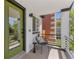 Close-up of front porch with seating and view of greenery, perfect for relaxing at 1845 W 39Th Ave, Denver, CO 80211
