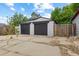 View of detached two car garage with a wide concrete driveway at 1845 W 39Th Ave, Denver, CO 80211