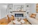 Cozy living room with a fireplace, built-in shelves, stylish furniture and neutral tones at 1845 W 39Th Ave, Denver, CO 80211
