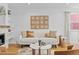 Elegant living room with hardwood floors, a stone fireplace, and sophisticated decor at 1845 W 39Th Ave, Denver, CO 80211