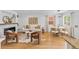 Inviting living space with a stone fireplace, hardwood floors, and a dining area creating a cozy and stylish home at 1845 W 39Th Ave, Denver, CO 80211