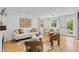 Bright living room with hardwood floors, modern furniture, and neutral tones creating an inviting and stylish space at 1845 W 39Th Ave, Denver, CO 80211
