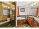 Luxurious bathroom featuring a glass-enclosed shower and a soaking tub with designer tile at 25015 E Park Crescent Dr, Aurora, CO 80016