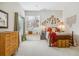 Cozy bedroom featuring stylish decor, large window, and natural light at 25015 E Park Crescent Dr, Aurora, CO 80016