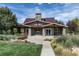 Community clubhouse surrounded by a lush landscape at 25015 E Park Crescent Dr, Aurora, CO 80016