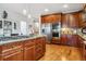 Spacious kitchen island with granite countertops, stainless-steel appliances, and ample storage at 25015 E Park Crescent Dr, Aurora, CO 80016