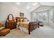 Serene main bedroom with a vaulted ceiling, bay window, and traditional wood furniture at 25015 E Park Crescent Dr, Aurora, CO 80016