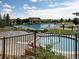 Community swimming pool and splash pad area under a sunny sky at 25015 E Park Crescent Dr, Aurora, CO 80016
