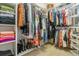 Spacious walk-in closet with custom shelving and ample storage for clothing and accessories at 25015 E Park Crescent Dr, Aurora, CO 80016