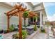 Inviting backyard featuring a pergola, outdoor seating, and manicured landscaping at 21492 E 60Th Ave, Aurora, CO 80111